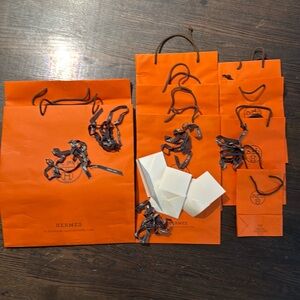Hermes shopping bags x 9 bags ,with 5 ribbons and receipt envelopes